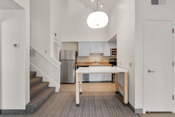 Clean design living room with furniture at AVIA Lofts on Parkway, Washington , 98662
