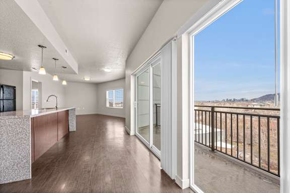 A modern kitchen with a view of the outdoors. at Wilmington Flats Apartments, Utah