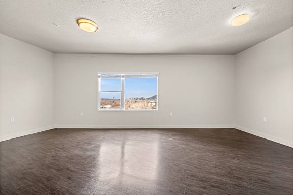 Empty room with a window showing a view of a field. at Wilmington Flats Apartments, Salt Lake City, UT, 84106