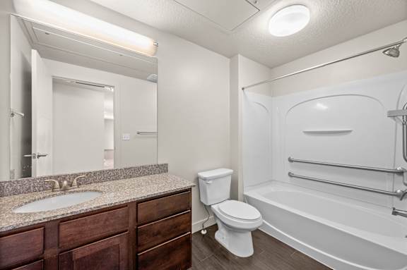 A bathroom with a sink, toilet, and bathtub. at Wilmington Flats Apartments, Salt Lake City, Utah