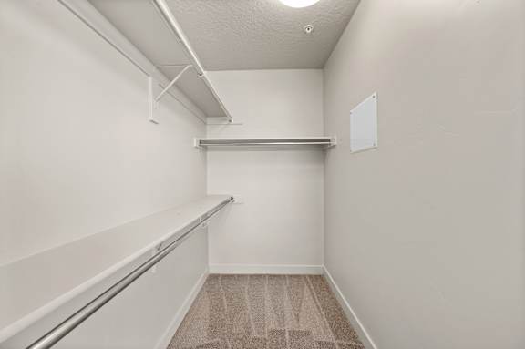 A white room with a carpeted floor and a whiteboard on the wall. at Wilmington Flats Apartments, Apartments, Salt Lake City, UT