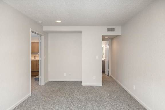 Room with white walls at AVIA Apartments at 110th Street, Kansas, 66211