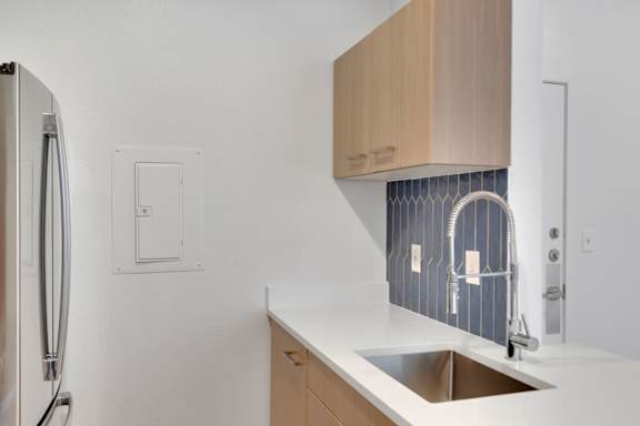 Kitchen with Sink1 at AVIA Apartments On Alpha, Dallas, Texas