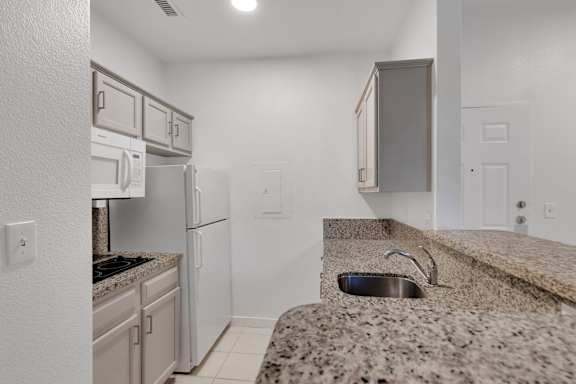 Kitchen with granite countertop3 at AVIA Apartments On Alpha, Texas, 75240