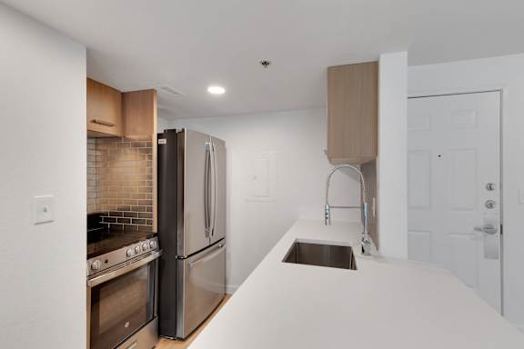 Fridge in kitchen1 at AVIA Apartments On Alpha, Dallas