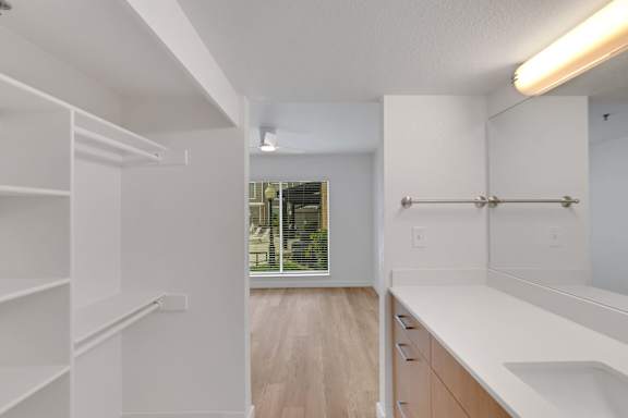 White closet and sink1 at AVIA Apartments On Alpha, Dallas