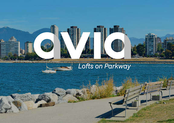 Avia logo with a parkway and lofts in the background. at AVIA Lofts on Parkway, Vancouver, WA 98662