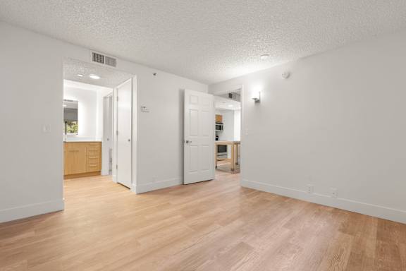 Brown wooden floor and two doors at AVIA Lofts on Parkway, Vancouver, 98662
