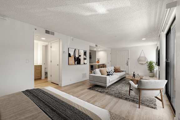 A modern living room with a white couch and sofa at AVIA Lofts on Parkway, Vancouver, 98662