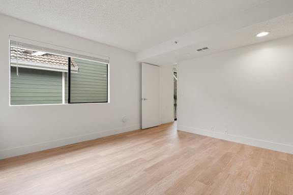 Large room with window and door at AVIA Lofts on Parkway, Vancouver, WA