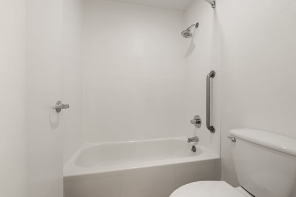 bathroom with a bathtub at AVIA Lofts on Parkway, Vancouver Washington