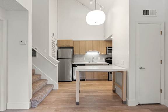 Sophisticated living and kitchen at AVIA Lofts on Parkway, Vancouver