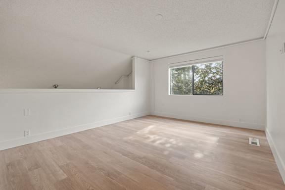 Minimal empty room with white walls and window at AVIA Lofts on Parkway, Vancouver, WA