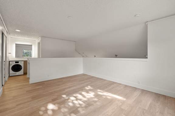 Large vacant room with clean design at AVIA Lofts on Parkway, Washington , 98662