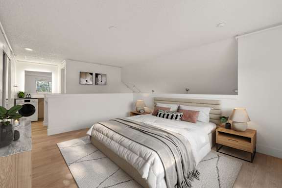 Modern bedroom with cozy bed at AVIA Lofts on Parkway, Vancouver, 98662