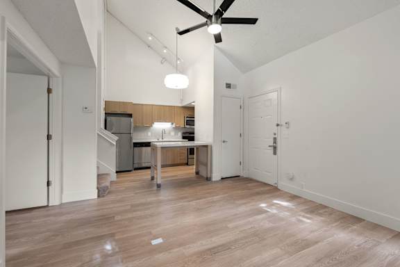 Sleek living room and Kitchen combo at AVIA Lofts on Parkway, Vancouver