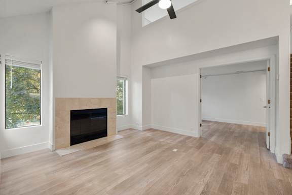 A room with a fireplace and wood flooring. at AVIA Lofts on Parkway, Vancouver, WA