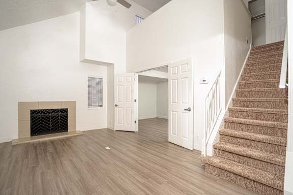 Room with Staircase and a fireplace at AVIA Lofts on Liberty Ridge, Florida,32256