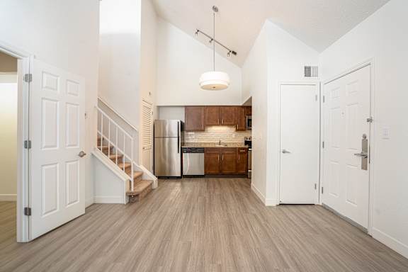 Kitchen with a refrigerator at AVIA Lofts on Victors Way, Michigan , 48108