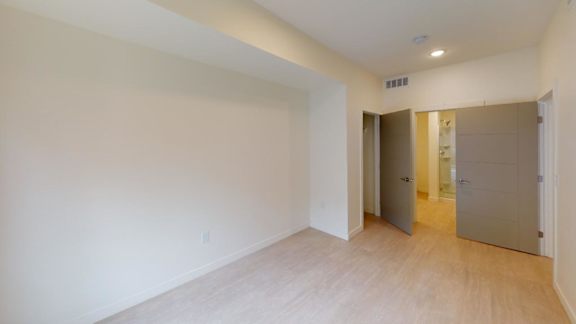 A room with a wooden floor and white walls. at Paperbox Lofts Apartments, Apartments, Salt Lake City  , UT