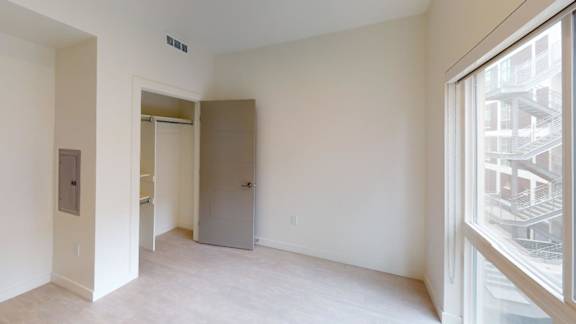 A room with a door and a window. at Paperbox Lofts Apartments, Salt Lake City  , 84101