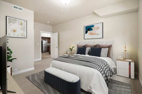 A bedroom with a large bed and a painting on the wall. at Siena Villas Apartments, Orem, UT, 84097