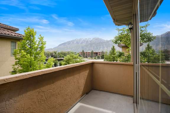 A balcony with a view of a mountain range at Siena Villas Apartments, Utah