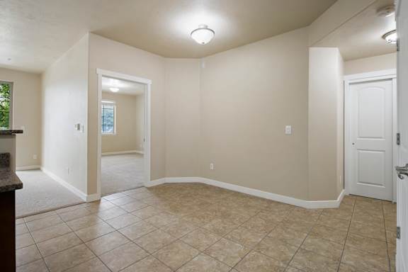 A room with a tiled floor and white walls. at Siena Villas Apartments, Apartments, Orem, UT