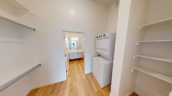 washer and dryer and a white closet  at SevenO2 Main Apartments, Salt Lake City