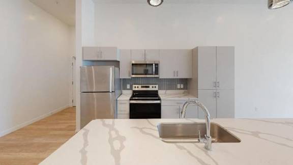 Sink With Faucet at SevenO2 Main Apartments, Utah