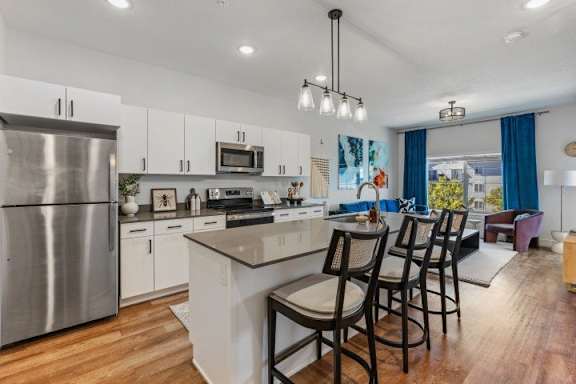 A modern kitchen with counter and stainless steel appliances. at The Revival, Salt Lake City