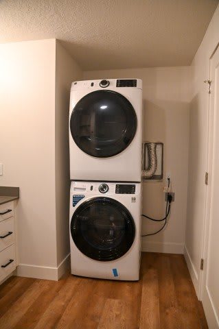 Stacked front load washer and dryer in alcove at The Revival Apartments, Salt Lake City