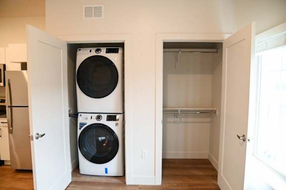 Stacked washer and dryer with closet storage at The Revival Apartments, Salt Lake City, 84101