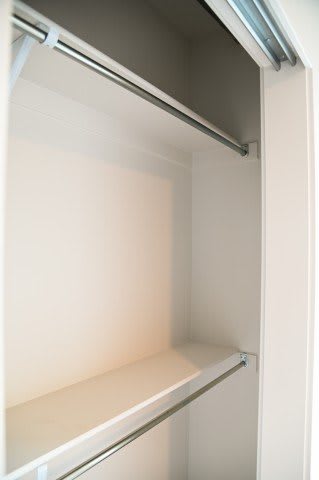 A white refrigerator with the door open.