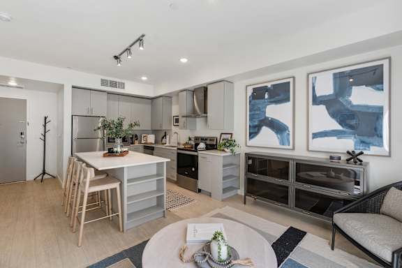 A modern kitchen with a dining table and chairs. at Paperbox Lofts Apartments, Salt Lake City  , UT, 84101