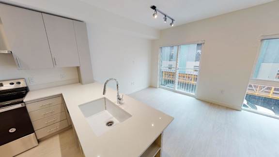 A kitchen with a sink and a window. at Paperbox Lofts Apartments, Salt Lake City  , 84101
