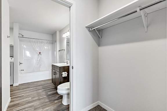 a bathroom with a toilet and a bathtub at Red Rock Apartments, South Dakota 57702