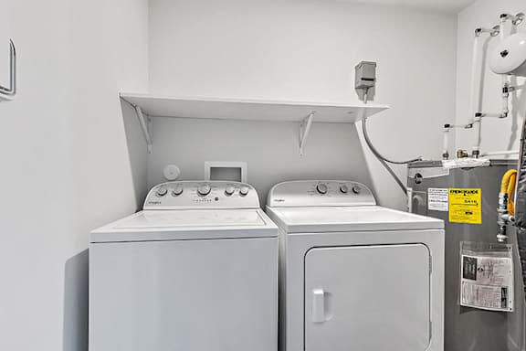 a washer and dryer in a laundry room at Red Rock Apartments, Rapid City, 57702