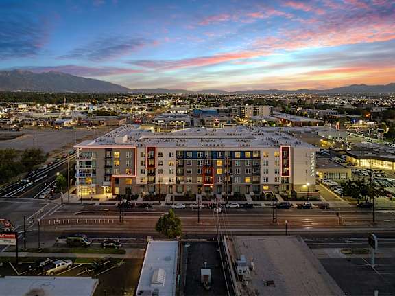 A large building with a parking lot in front of it.