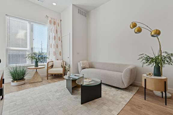 A living room with a couch, armchair, and coffee table.