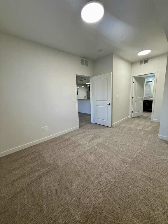 Vacant room with carpeted floor at The View on 20th, Ogden, UT