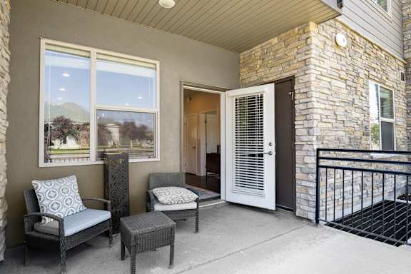 Patio with chair and cushions at The Flats at Riverwoods, Provo, 84604