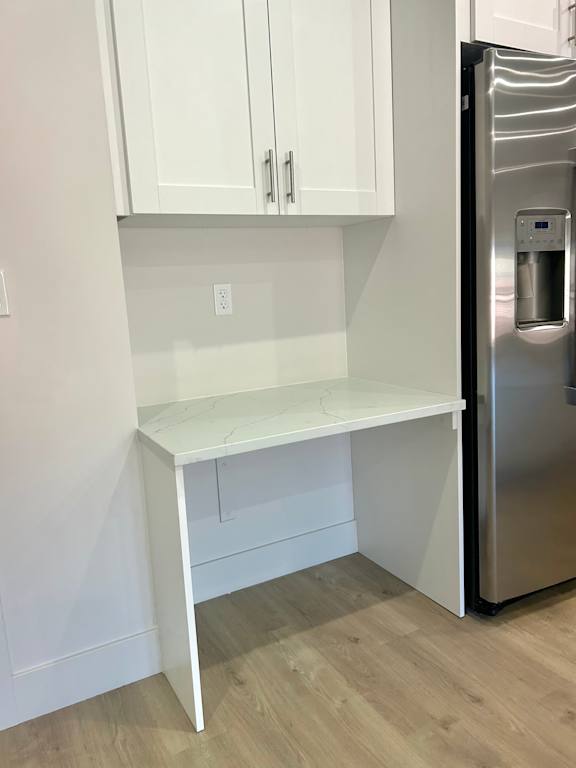 Small desk and cabinets near kitchen at The Vue At Desert Color, St. George, UT, 84790