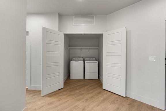 A laundry room with a washer and dryer. at The Vue At Desert Color, St. George, 84790