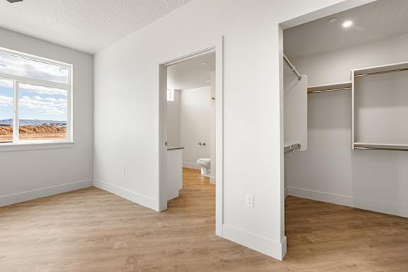A room with a window and a door leading to another room at The Vue At Desert Color, Utah, 84790.