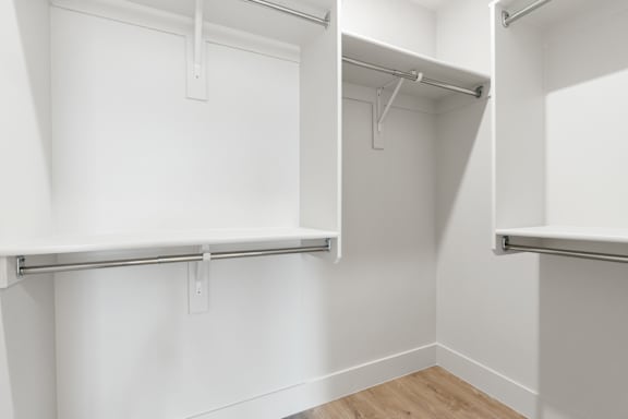 A white closet with shelves and hangers. at The Vue At Desert Color, St. George, Utah