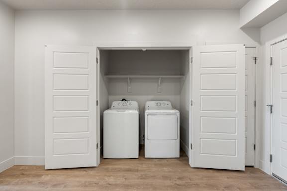 A laundry room with a washer and dryer in it. at The Vue At Desert Color, Utah, 84790