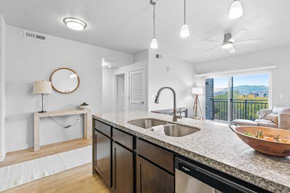 A modern kitchen with a large island and a view of the city. at Wilmington Flats Apartments, Salt Lake City, Utah