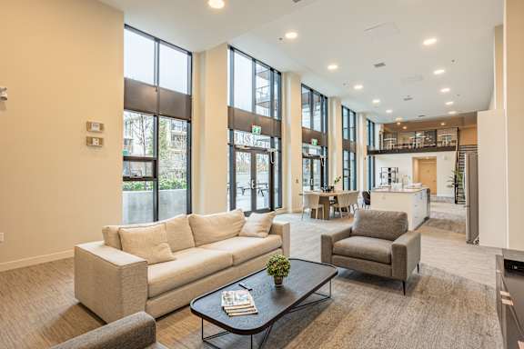 A living room with a couch, armchair, and coffee table.