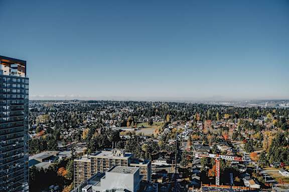 A cityscape with a mix of residential and commercial buildings.